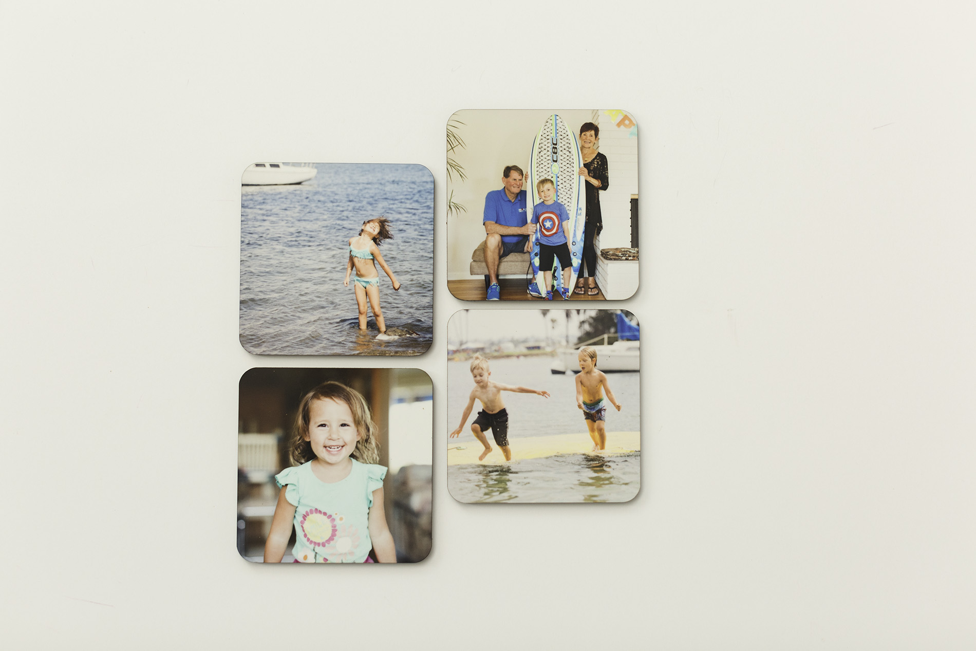 photo coasters laid out on a white table