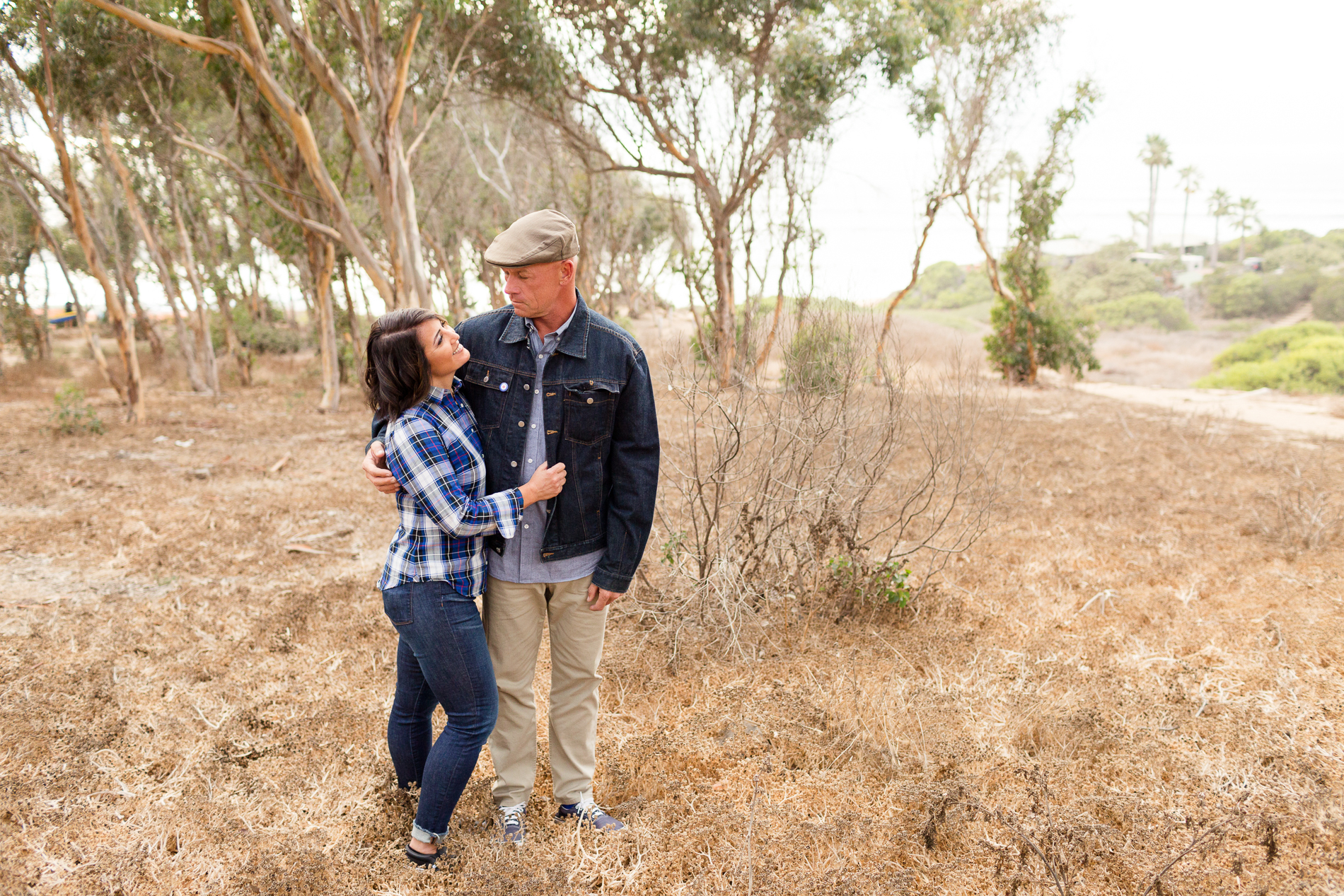 couple walking through eucalyptus grove in San Diego