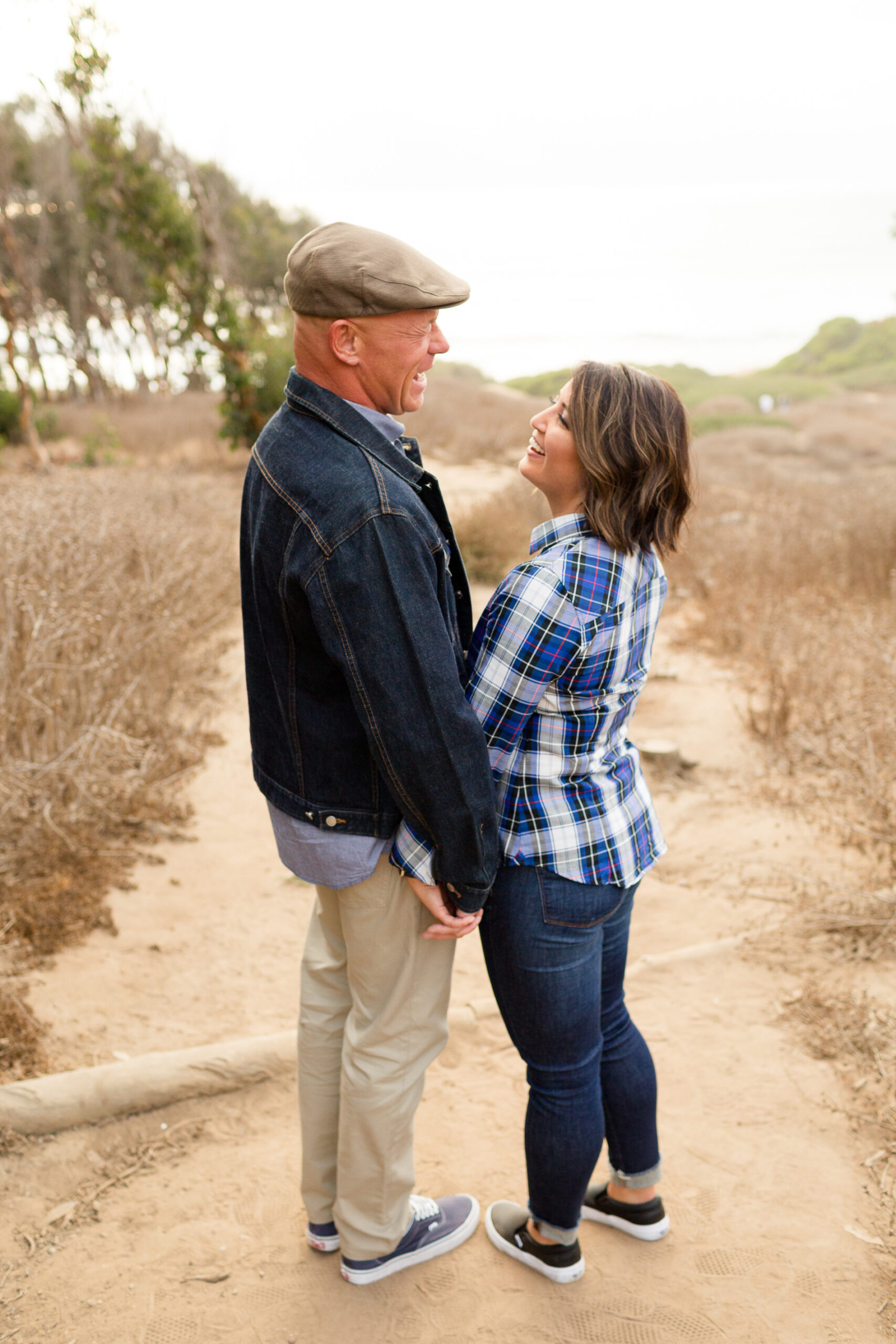 couple laughing at sunset cliffs