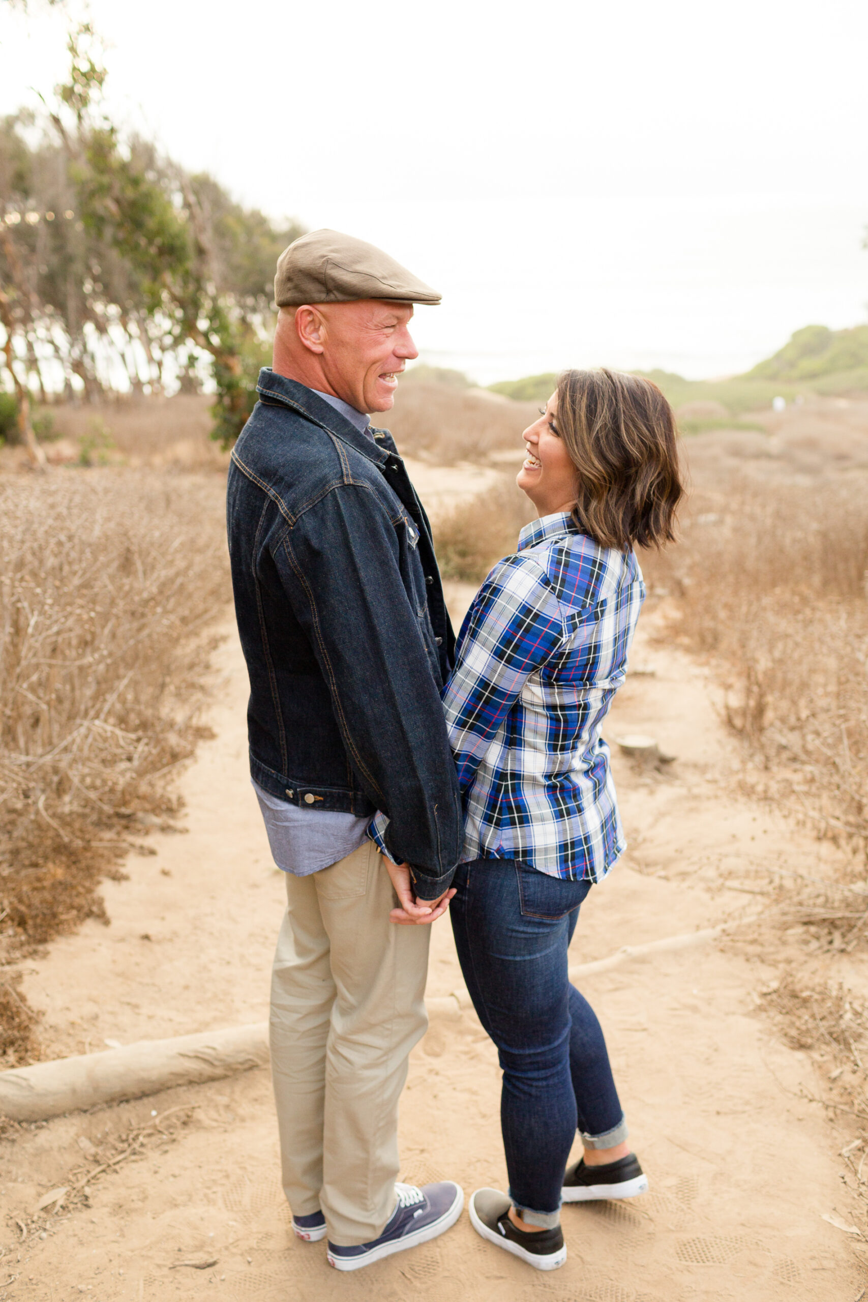 couple laughing at sunset cliffs