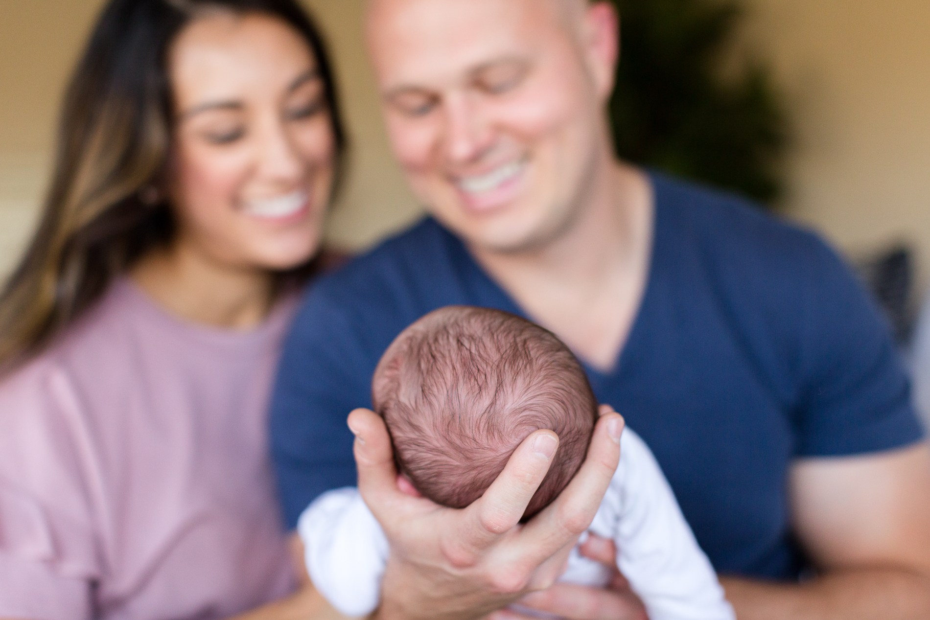 San Diego Lifestyle Newborn Photographer Christine Dammann Photography happy parents holding baby