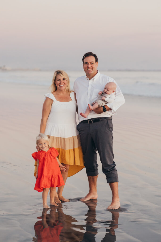 San Diego family photographer Christine Dammann takes pictures of a family having fun together at their favorite beach on Coronado island.