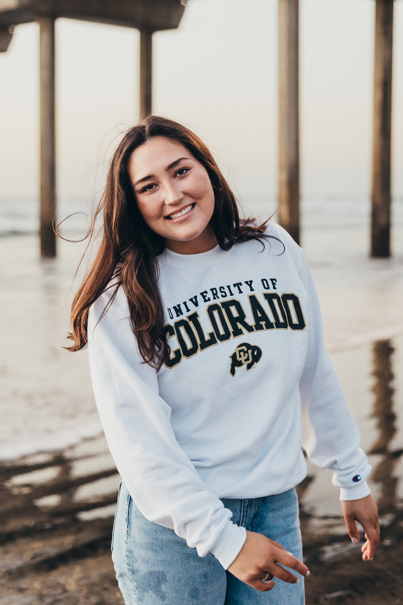 Girl taking senior photos in San Diego on the beach