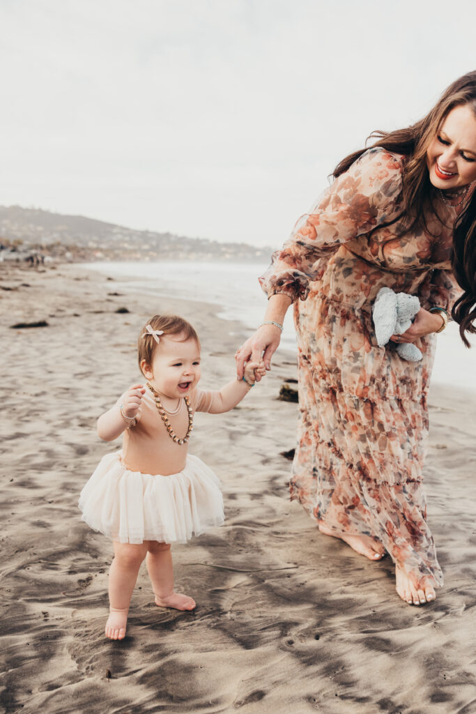 Mother and daughter enjoying San Diego beach