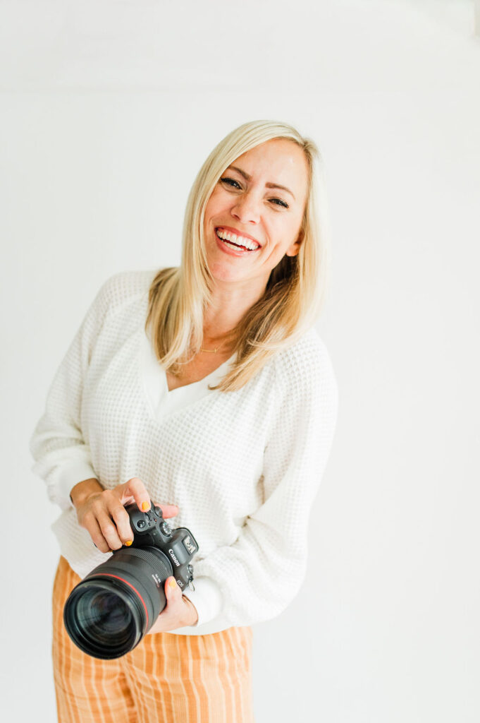 female photographer holding camera