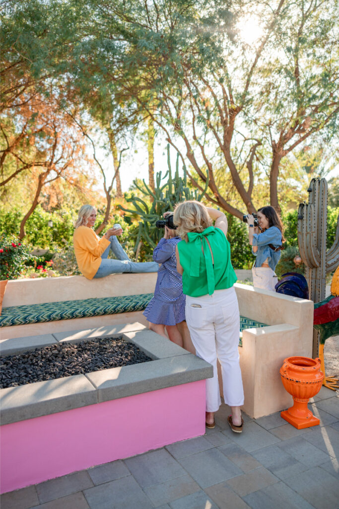 Photographers working together during outdoor session, showcasing collaboration in SEO vs social media marketing approach